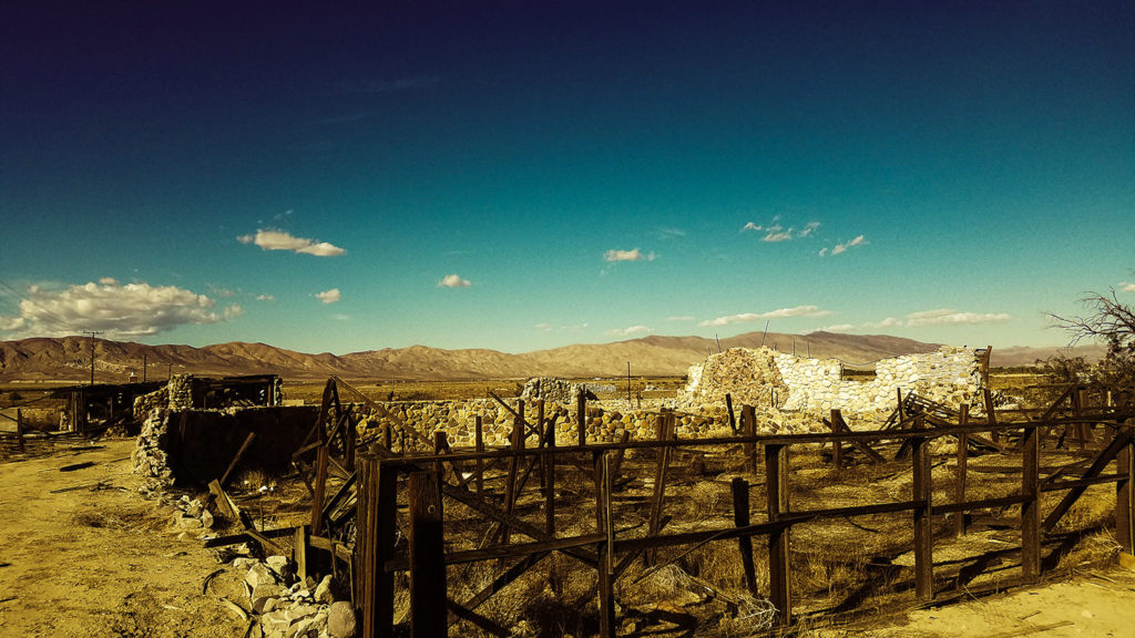 abandoned stone house in ruins in the California desert