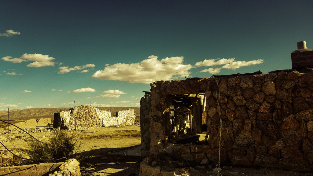 abandoned stone house in ruins in the California desert