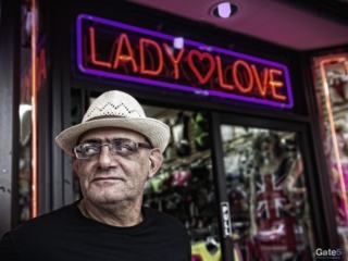the male owner stands in front of his storeo the Lady Love on Hollywood Blvd